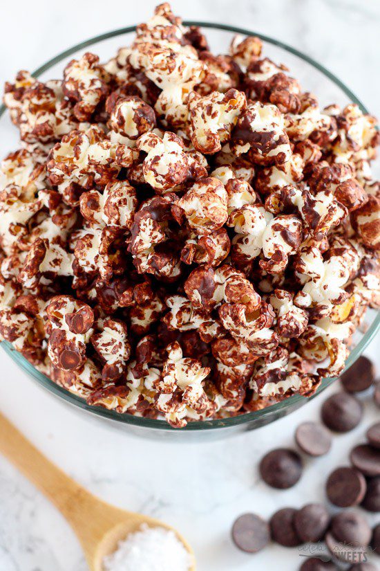 A healthy sweet and salty snack of popcorn drizzled with melted dark chocolate and sprinkled with sea salt. Part dessert, part snack – completely delicious!