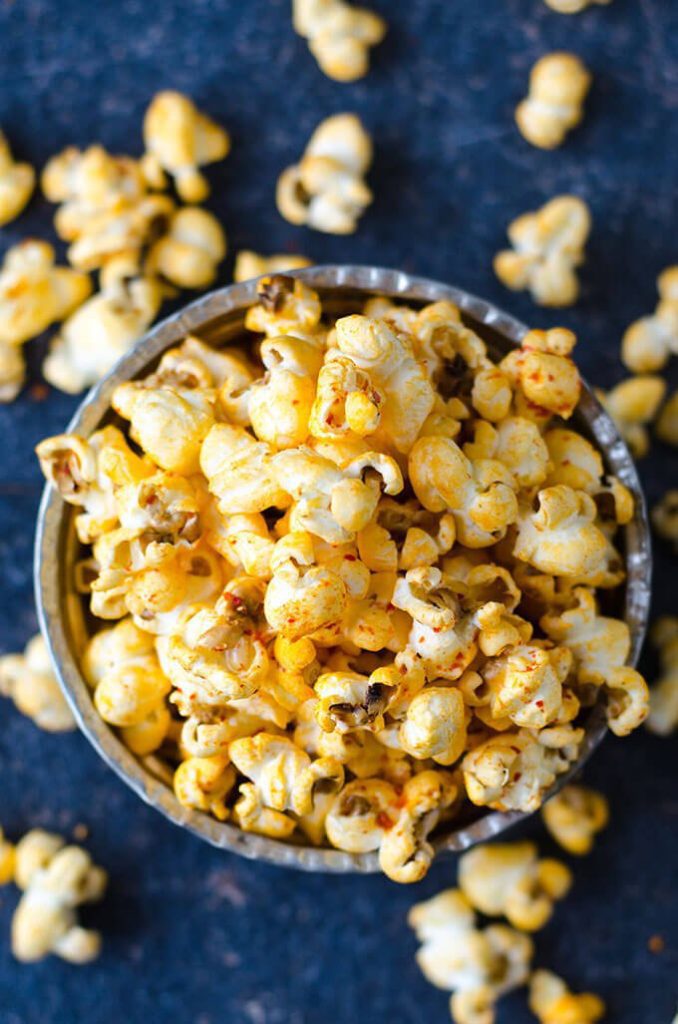 Salty Spicy Popcorn is the best game day snack. Seasoned with chili, cumin and black pepper. You won't want to buy spicy and crunchy chips from store while you can easily make it at home on the stove.