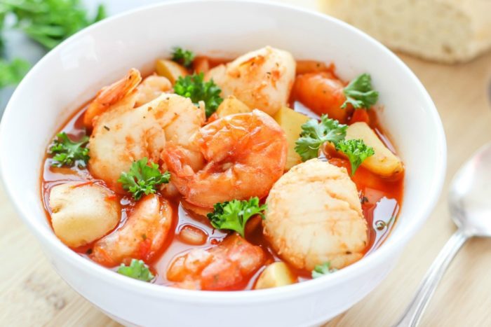 A delicious seafood recipe cooked in a tomato-based broth with potatoes. This slow cooker seafood stew is comforting and is an easy to make dinner recipe.