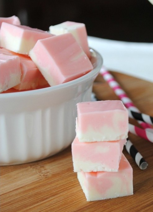 Velvety smooth fudge that’s pretty in pink! This Strawberry Swirl Fudge recipe makes it easy to create homemade candy with swirls of vanilla and strawberry fudge with no candy thermometer needed!