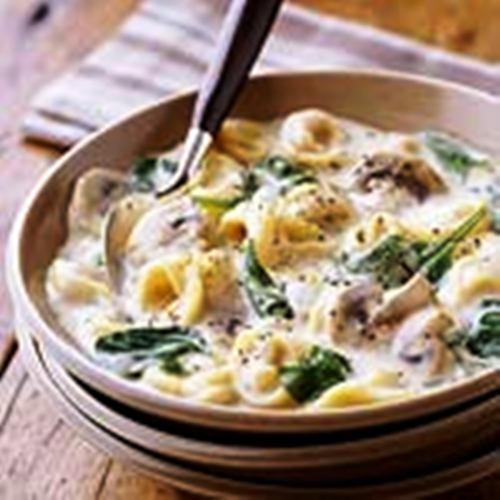 A white sauce mix and dried tortellini make this satisfying soup recipe extra easy; stirring in the spinach at the last minute gives it fresh-from-the garden flavor.