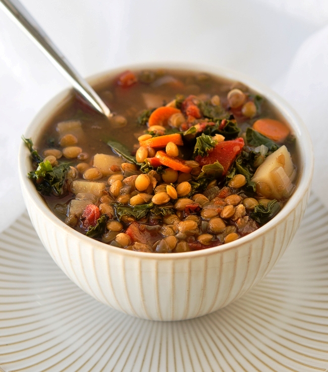 I adore hearty soups for dinner, and this delicious crock pot vegetable lentil soup is my latest favorite! This slow-cooker lentil soup is a top pick from my readers!