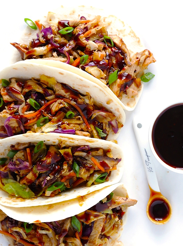 A versatile dish with pork or chicken with some vegetable and sauce use as a filling in a wrap for eating.
