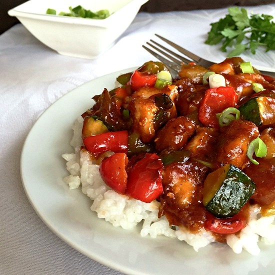 Chinese Sweet and Sour Chicken with vegetables, a tasty dinner dish ready in about 15 minutes. So much better and a lot healthier than any take away. Serve it with rice or noodles for a truly Asian feast.