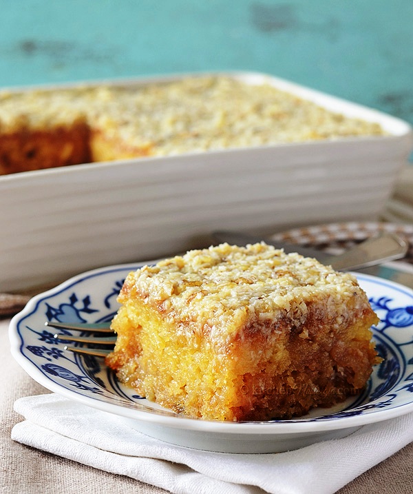 Pineapple dump/poke cake with coconut walnut frosting; super moist and ridiculously easy to make.