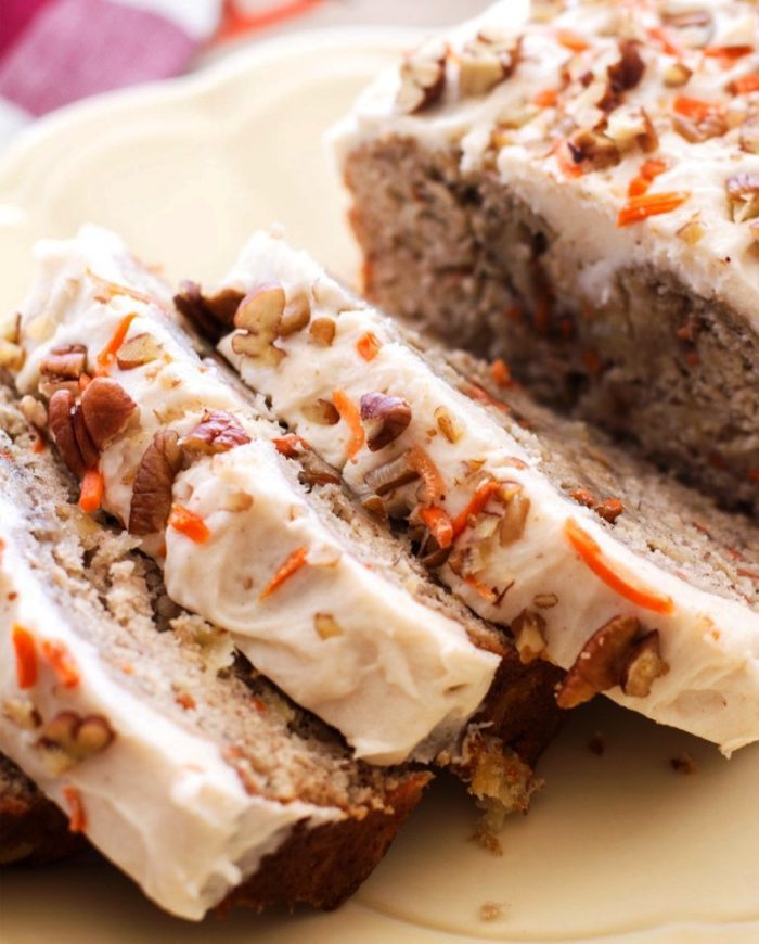 Moist, flavorful, and topped with rich homemade cream cheese frosting, this carrot cake banana bread is the ultimate dessert bread! A perfect Easter dessert.