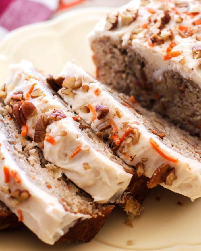 Moist, flavorful, and topped with rich homemade cream cheese frosting, this carrot cake banana bread is the ultimate dessert bread! A perfect Easter dessert.