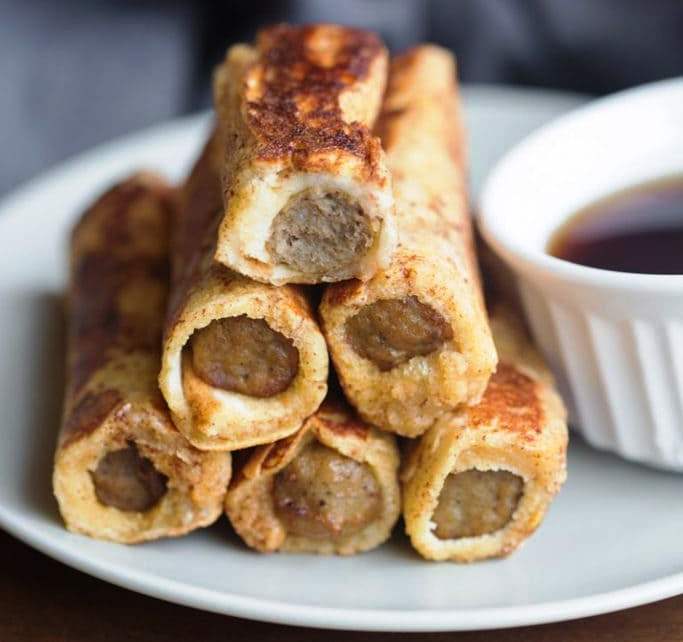 These easy French Toast Roll-Ups take my favorite French toast recipe and wrap it around a sausage link, making a fun, dunk-able finger food everyone loves.