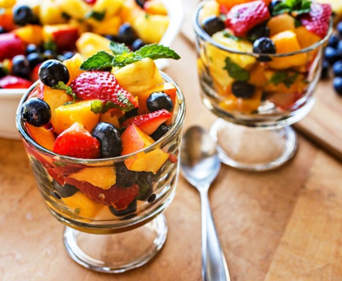 Rainbow fruit salad with citrus-honey dressing and fresh mint