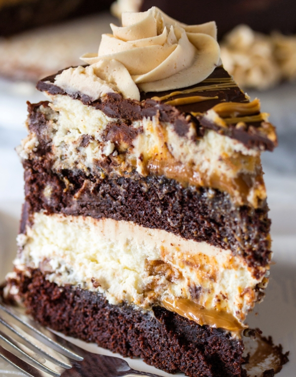 Delicious layers of moist chocolate cake, Reese’s cheesecake, caramel and peanut butter make up this Copycat Cheesecake Factory Reese’s Peanut Butter Chocolate Cake Cheesecake.