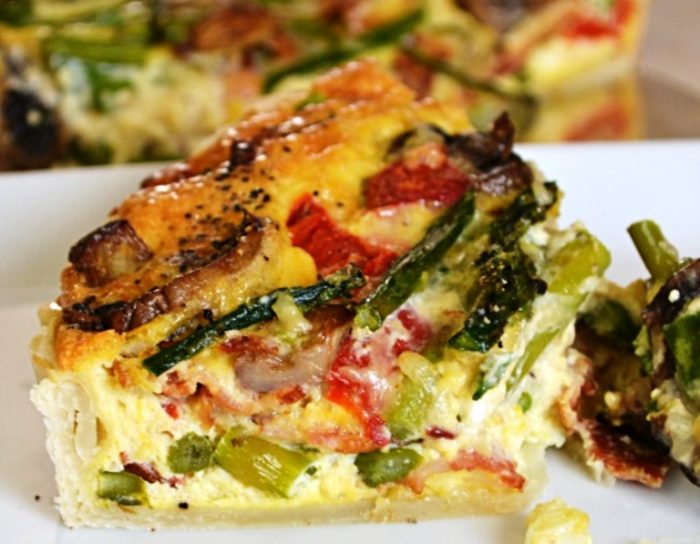 When it comes to quiche this recipe stands above all the rest! Full of smoky bacon, asparagus, mushrooms, red pepper….I could go on and on. This perfect semi homemade make ahead dish is what every hostess dreams of having. Perfect for Easter Brunch or a ladies luncheon.