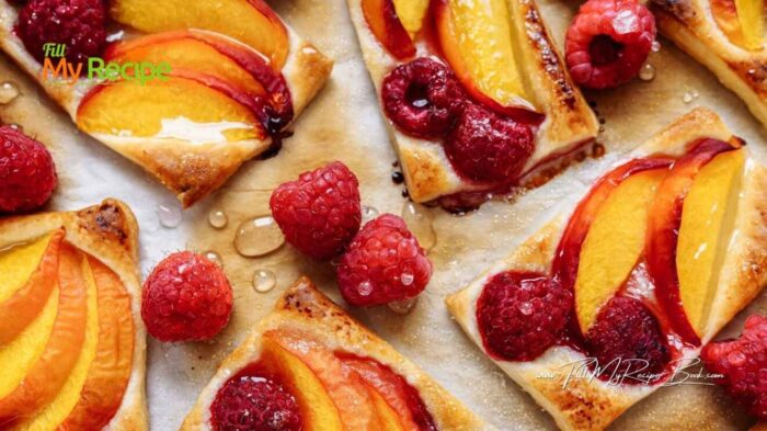 Bake Fresh Peach Shortbread Bars with raspberries recipe. A delicious dessert with every bite. Juicy oven baked peaches layered over a buttery shortbread crust.