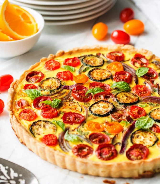 A tasty, fresh vegetable Farmers' Market Quiche filled with zucchini, onions, tomatoes and cheese. A wonderful addition to your brunch table!