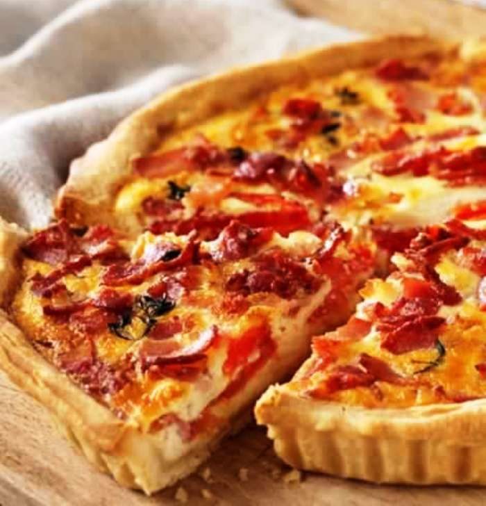 James Martin’s quiche recipe is made with a shortcrust pastry with bacon, tomato and cheese filling.