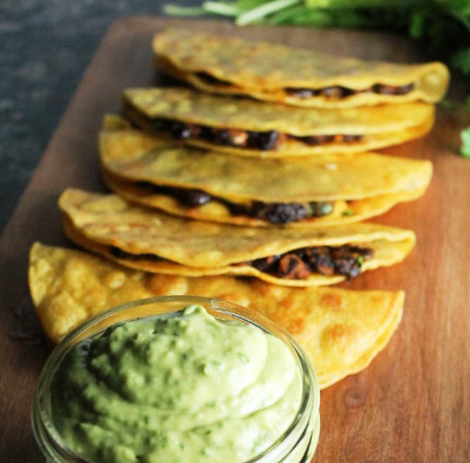 Crispy black bean tacos with avocado-lime sauce