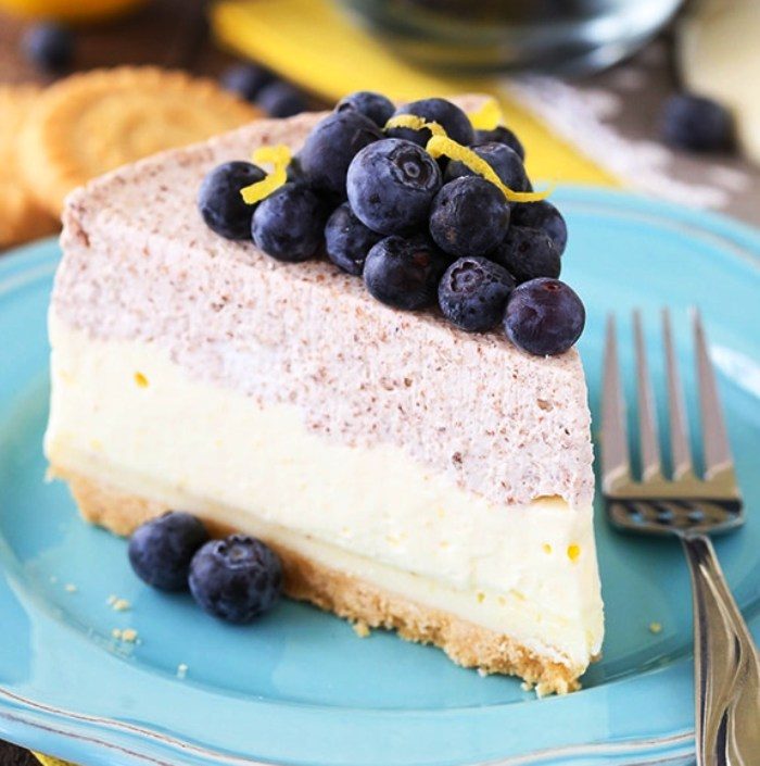 This Lemon Blueberry Shortbread Mousse Cake is to die for and perfect for spring and summer! It’s incredibly light and almost completely no bake! With layers of lemon and blueberry mousse, white chocolate ganache and a Walkers Shortbread crust, the only thing that requires a few minutes in the oven is the crust!