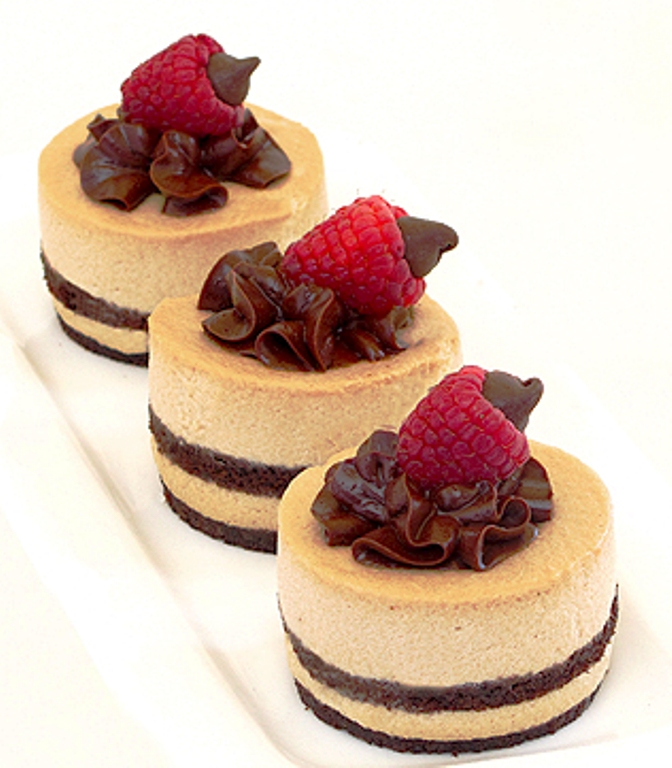 White Chocolate Mocha Mousse Cake ~ Easy elegance kicked up with a shot of espresso and smoothed out with some white chocolate. Layer this mocha mousse between two sheets of chocolate sponge cake and it will tempt even the most steadfast dieter.