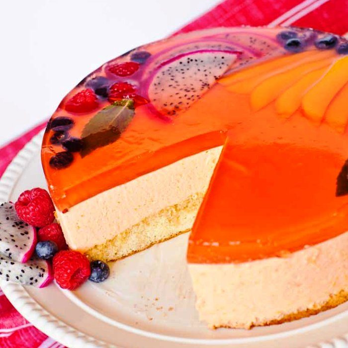 This mango mousse cake recipe is made with made with a fluffy sponge cake, real mango mousse layer, and a fruity jello topping. If you’re looking for a fruity, light and airy cake for your next special occasion, this is the cake for you.