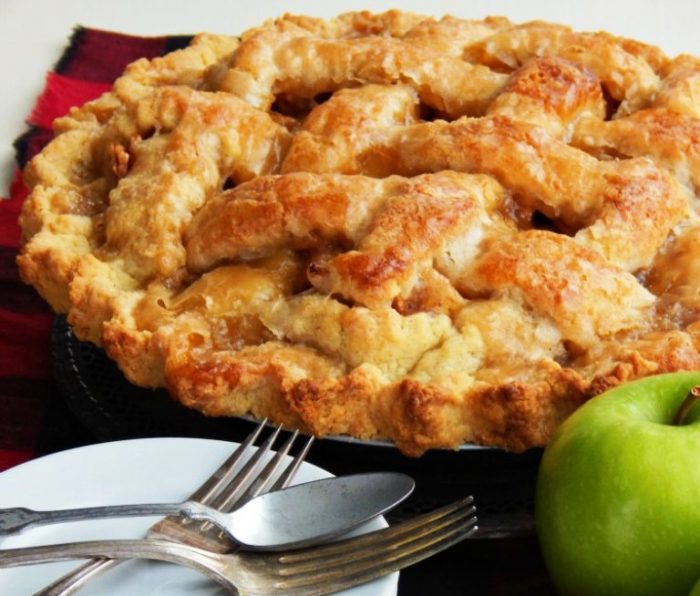 Everything about this pie is amazing, from the made from scratch flaky crust, and vibrant apple filling, to the sweet glaze drizzled on top of the pie before it is baked.