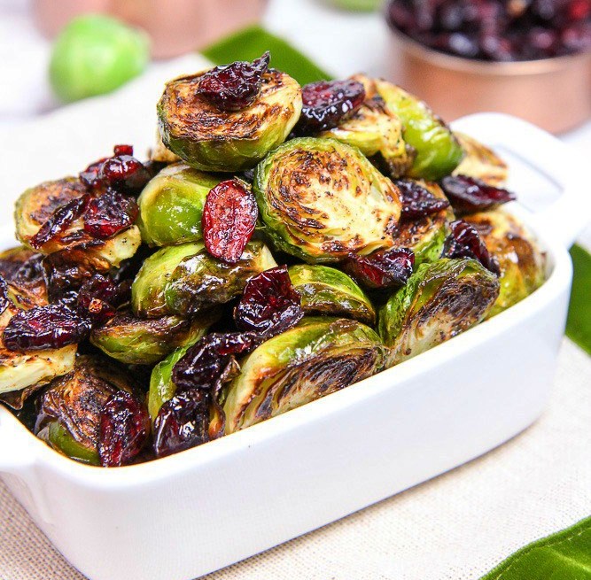 Maple Balsamic Brussels Sprouts and Cranberries are roasted to perfection and then tossed with sweet cranberries and a delectable maple balsamic dressing.