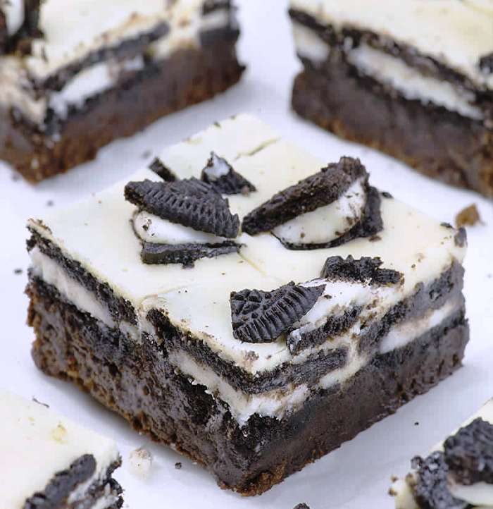 Oreo Loaded Cheesecake Brownies are rich and fudgy homemade brownies topped with a layer of double stuf Oreos, cheesecake, plus more Oreo cookies on top. In other words, these could be the best brownies you’ve ever tasted!