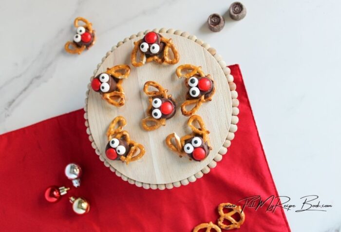 Make these quick Rolo Pretzel Reindeer recipe for a fun Christmas treat. Sweet, salty, and adorable holiday snacks perfect for gifting or parties!