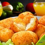 Salt Cod Fritters a Healthy Lunch recipe Idea with salad. A homemade fish cake or croquettes to serve for lunch meal a snack or appetizer.