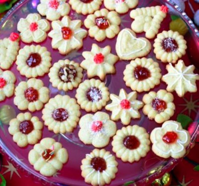 An Easy and delicious Christmas cookies recipe for a cookie press. This is a family favorite treat made year after year.
