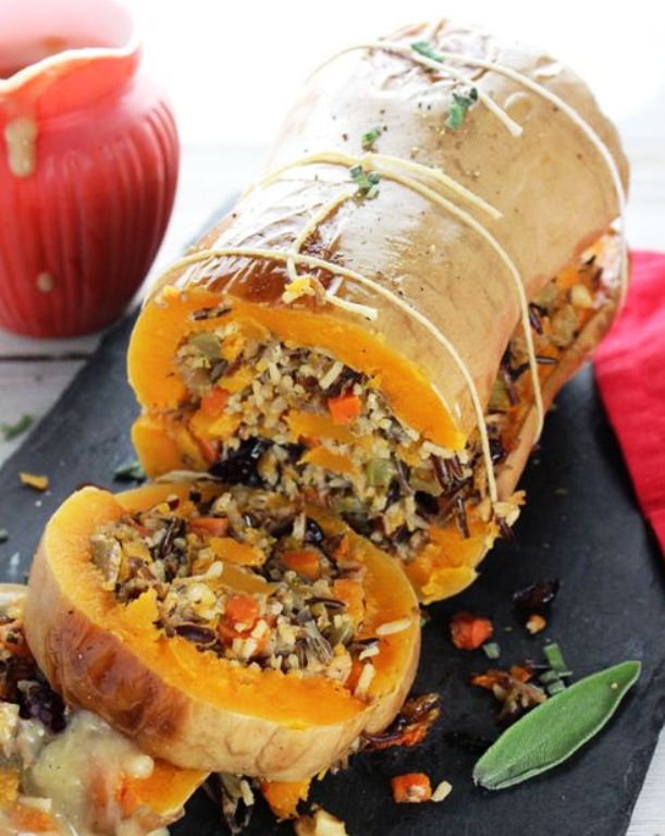 The perfect vegan centerpiece main dish for Thanksgiving, Christmas, or any holiday. Stuffed with super flavorful wild rice, cranberries, walnuts, and sage filling.