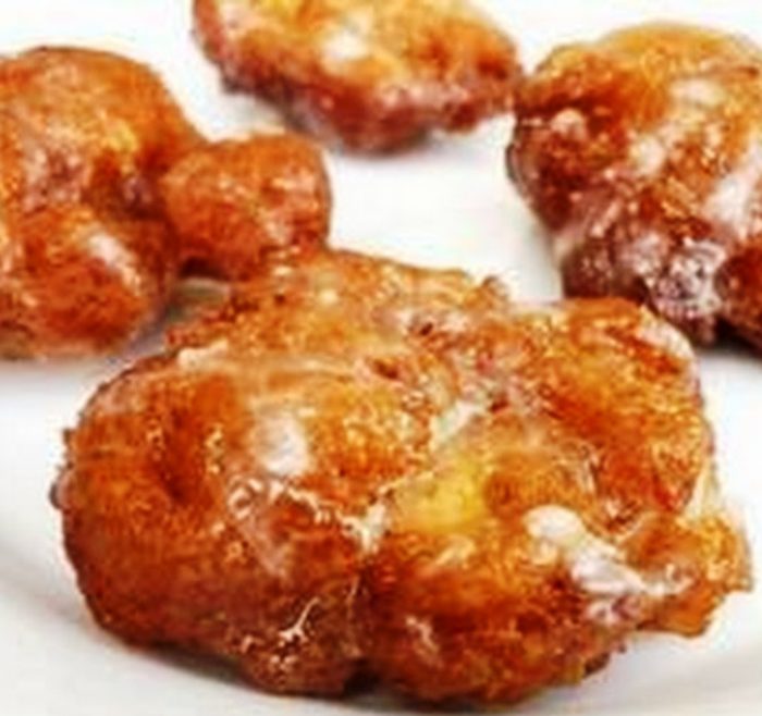 Deep fried Southern Apple Fritters dusted with powdered sugar. All I have to say is... um... YUM!