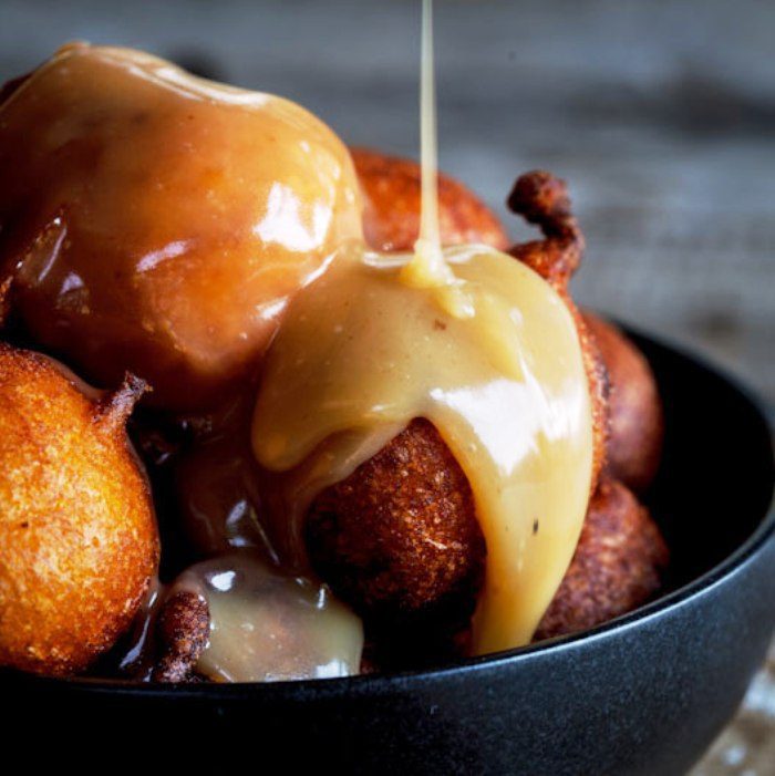 Light and fluffy pumpkin fritters (pampoen koekies) with caramel sauce. This recipe handed down to me by my grandmother is nostalgia on a plate and will become a family favorite in no time.