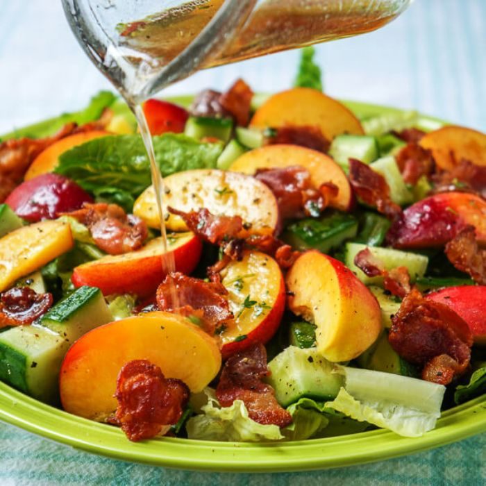 Honey lemon vinaigrette on bacon and peach salad