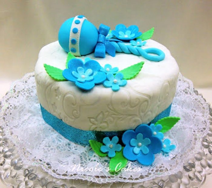 This cake was created for a Blue Baby Shower. The only requirement was that the color scheme for the cake must be Blue! This is the design that I came up with.