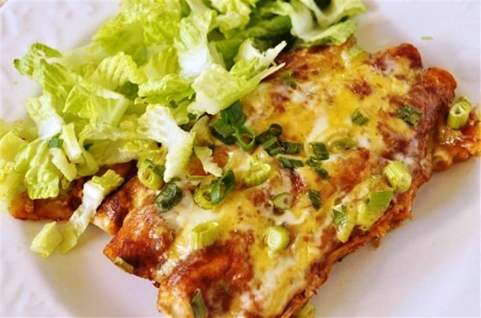 These delicious chicken enchiladas are quick and easy to make with leftover or store bought rotisserie chicken.  The addition of the homemade enchilada sauce makes them a crowd pleaser.