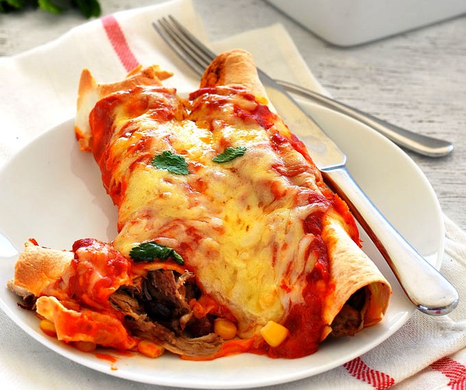 These Pulled Pork Enchiladas are made with Pork Carnitas and topped with a delicious homemade Enchilada Sauce!