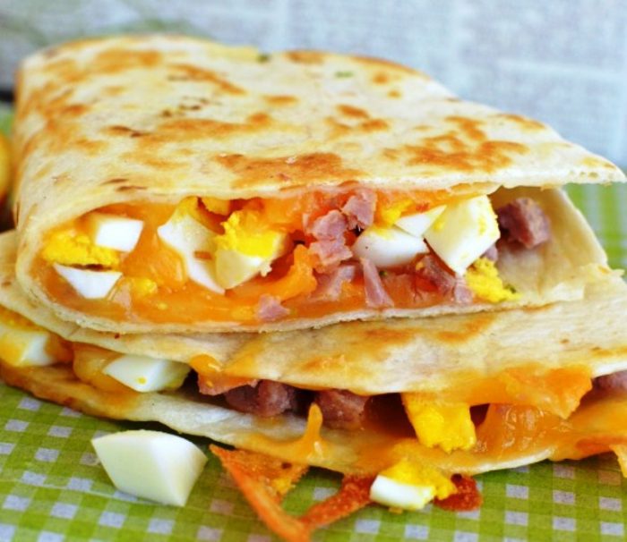 This recipe is easy to mostly make ahead of time, which makes mornings so much more fun! These breakfast quesadillas are filled with eggs, cheese, and diced ham. Hearty! Healthy! And Easy!