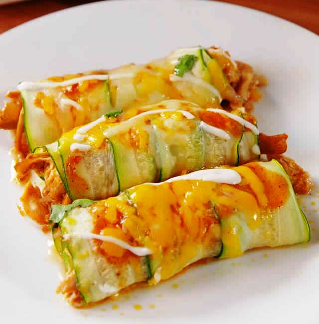  Instead of using flour tortillas, we use tender, thin slices of zucchini to wrap up the chicken. Smothered with melted Monterey Jack and spicy enchilada sauce, you'll barely notice the difference!