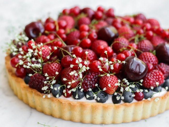 Whipped strawberry cream tart with berries