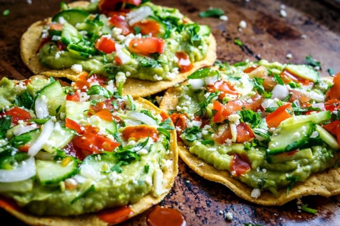 These Avocado Hummus and Cucumber Pico de Gallo Tostadas will make even carnivores enjoy a vegetarian delight that can be prepared in only 15 minutes and requires no cooking time.