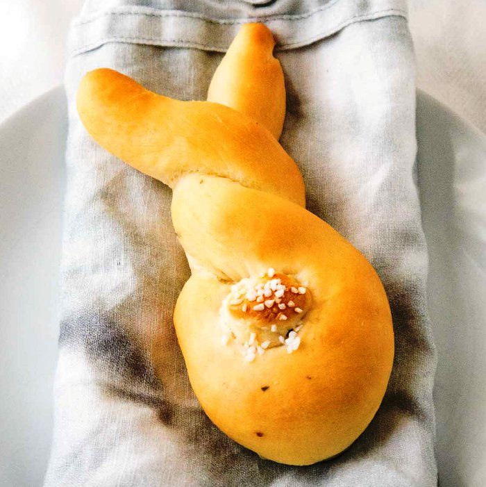 These Easter Bunny Rolls are so easy to make and perfect for brunch or dinner! Made from fool-proof homemade yeast dough, these cute bunny-shaped rolls are buttery, fluffy, and so cute with their salty tails.