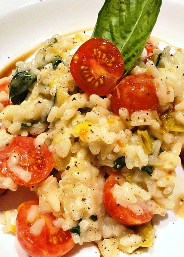 Easy caprese risotto is a great way to use the last of your fresh, late-summer tomatoes and basil! Tender arborio rice, fresh garden tomatoes and basil, soft mozzarella cheese, and a drizzle of balsamic glaze on top.