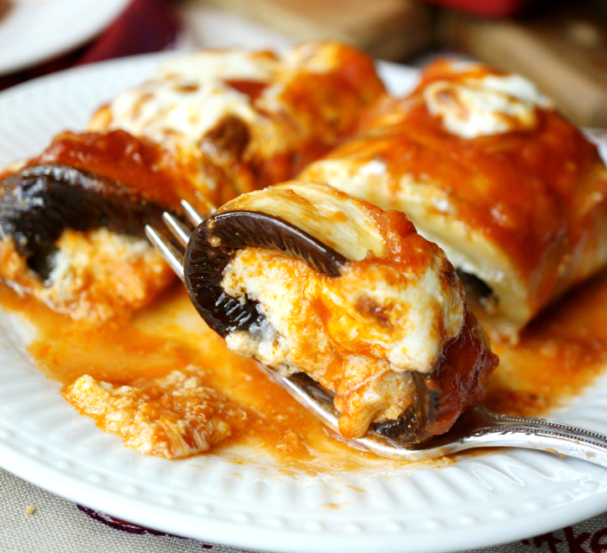 a delicious, incredibly cheesy recipe to share with you today. Say hello to Eggplant Rollatini! They're definitely not a family recipe, and American-Italian at best, but oh they are sooo good.