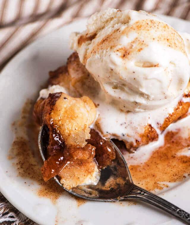 Instant Pot Apple Dumplings are ready in under 30 minutes! This easy apple dumpling recipe uses crescent rolls and a brown sugar, cinnamon, apple cider syrup to make a quick dessert that tastes like fall.