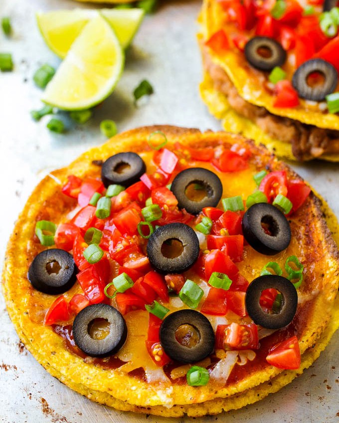 This Mexican pizza recipe is layers of taco meat and beans sandwiched between two crispy shells and topped with plenty of melted cheese and toppings. SO much better than Taco Bell!