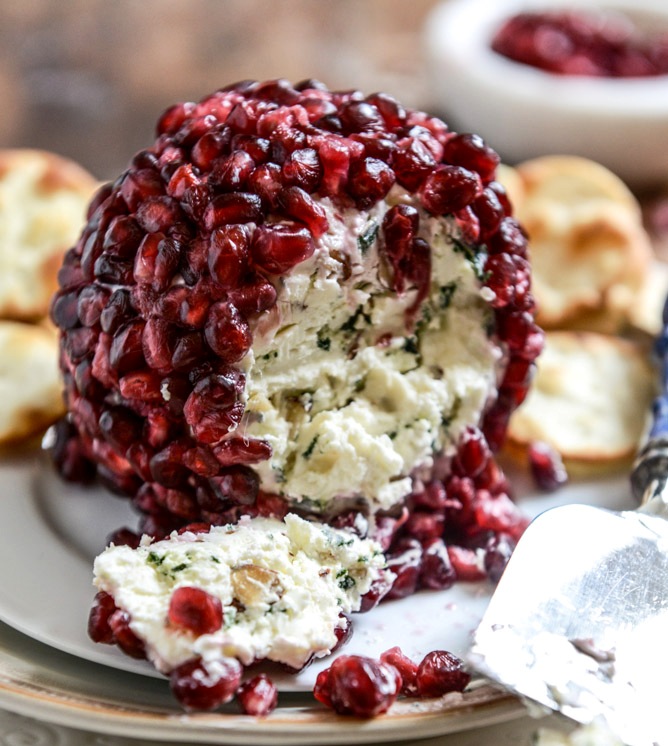 Pomegranate-jeweled-white-cheddar-toasted-almond-and-crispy-sage-cheeseball