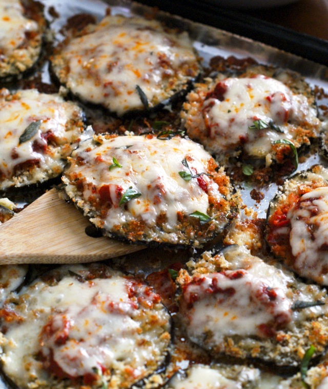 Sheet Pan Eggplant Parmesan is my favorite eggplant recipe that is made by baking breaded eggplant slices on a sheet pan until perfectly golden and then topping them with robust tomato sauce and lots of melty mozzarella cheese.