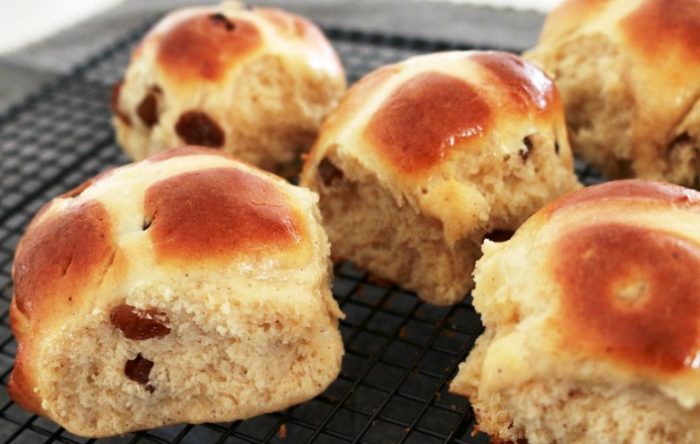 Traditional buns lightly spiced with cinnamon and nutmeg and with sweet sultanas or raisins throughout... make a batch for Easter breakfast and serve warm with butter.