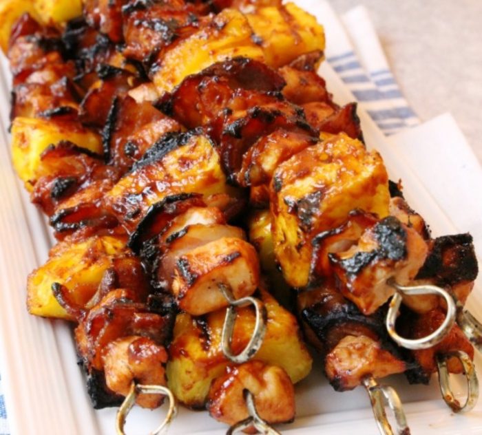 BBQ Chicken Kabobs recipe with tender chicken grilled with pineapple and bacon then slathered with your favorite BBQ sauce. These ultimate BBQ recipe for grilled chicken kabobs are perfect for your next cookout!