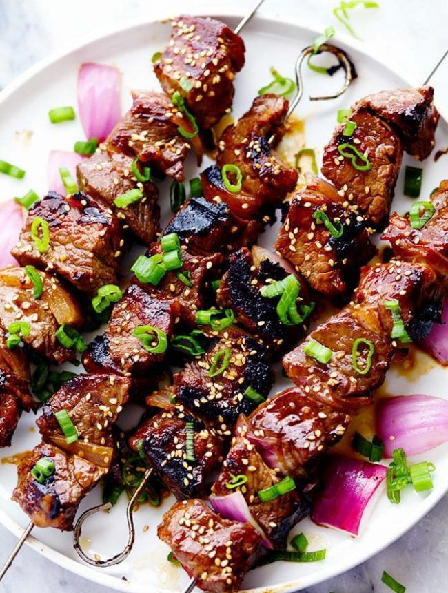 Delicious Grilled Asian Garlic Steak Skewers are marinated in a delicious Asian garlic sesame sauce and grilled to tender and juicy perfection.  A fun and unique addition to any gathering!