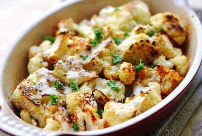 In this easy recipe for roasted cauliflower, the florets are tossed with olive oil, garlic, and parmesan and then baked until golden.